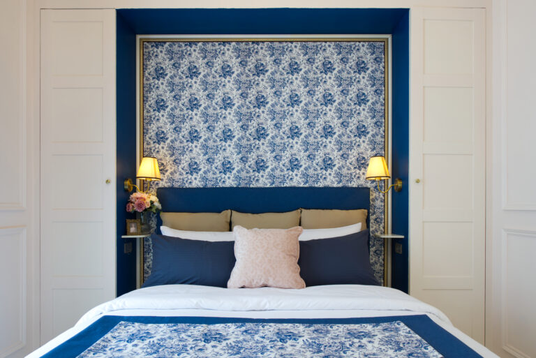 View towards bed in alcove completed with bedside lighting