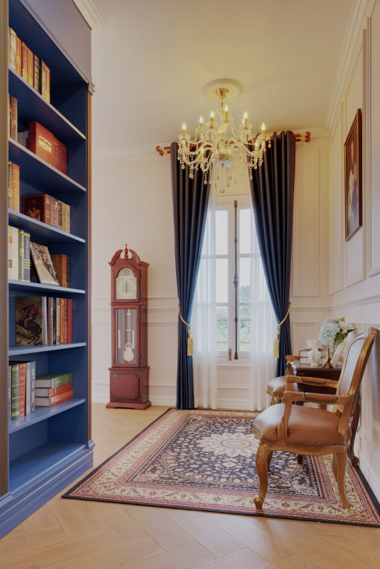 View of library area, sitting space in upper flow, clock and stairs