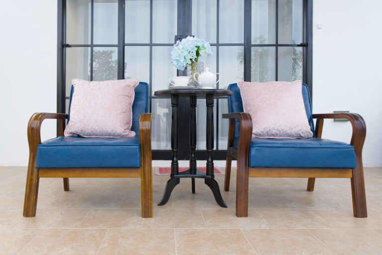 Sitting area facing swimming pool with living room in background